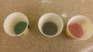 Left: Red Cabbage Water mixed with Baking Soda (a base); Center: Red Cabbage Water alone; Right: Red Cabbage Water mixed with vinegar (an acid)