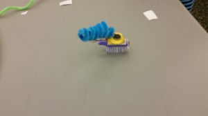 A brushbot decorated with pipe cleaners