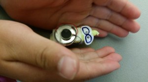 A Brush Bot with the motor attached directly to the positive and negative terminals of a 3V button battery